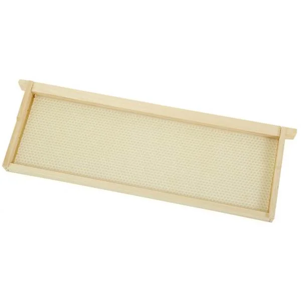 Wooden hive frame fitted with a pale sheet of wax foundation