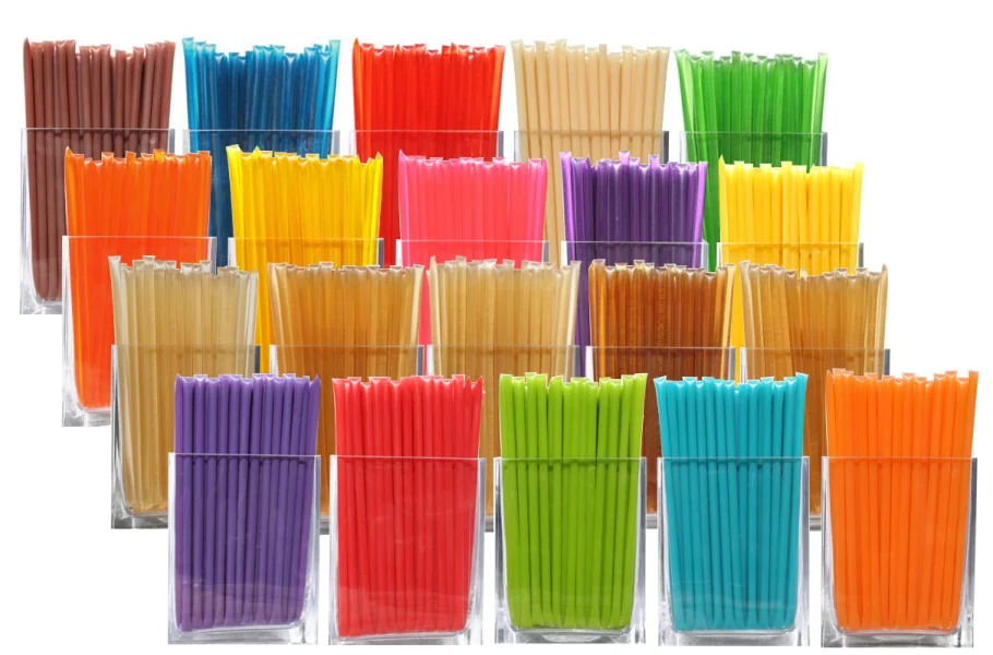 Honey sticks in many colors standing upright in rows